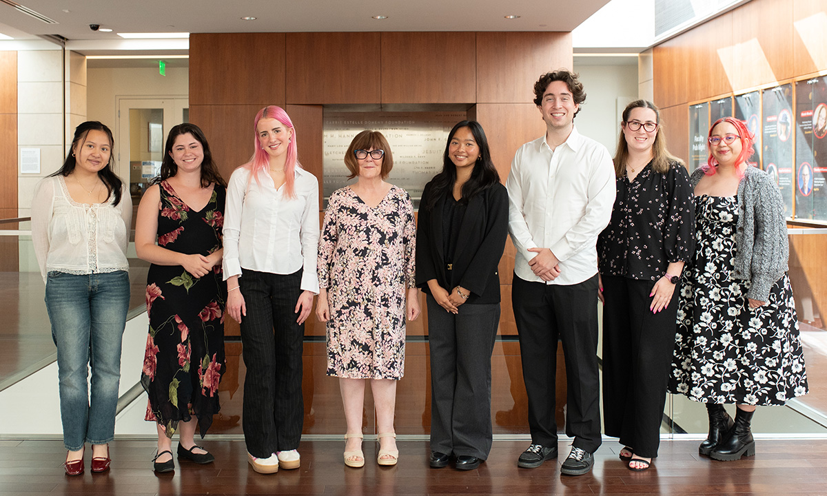 seven students standing with the dean